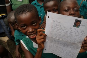 A child with her pen-pal letter.